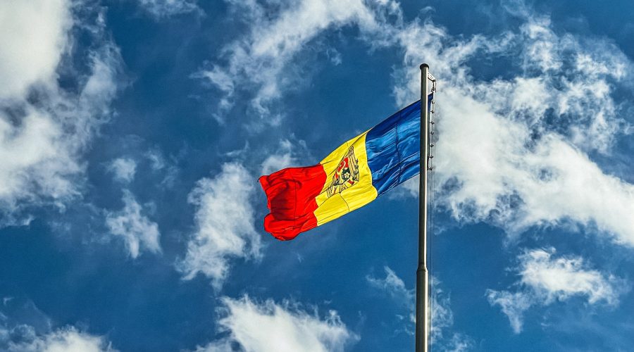 red blue and yellow flag under blue sky during daytime