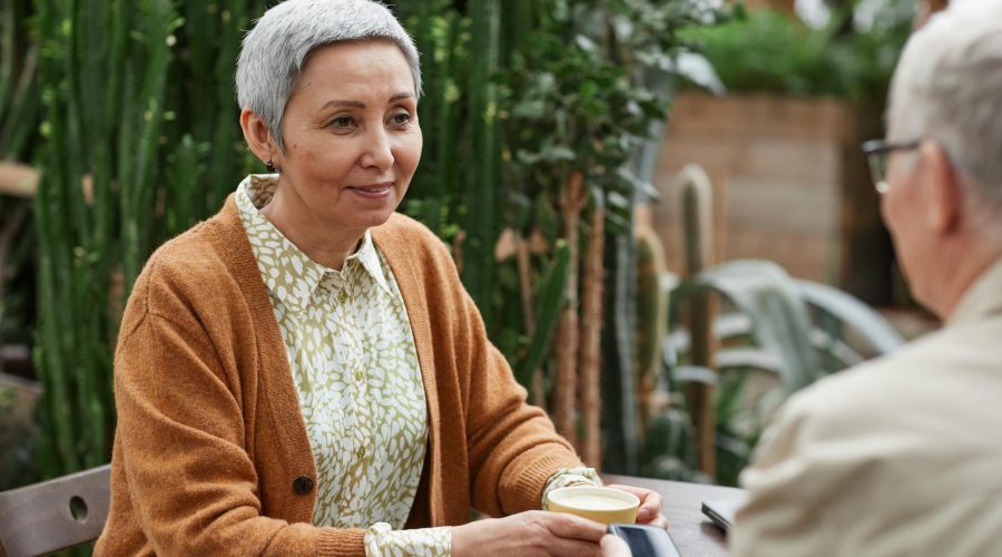 Woman Smiling While Looking at Her Man