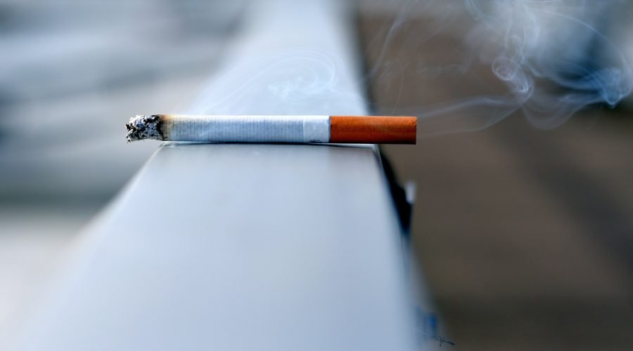 white cigarette stick on white wall
