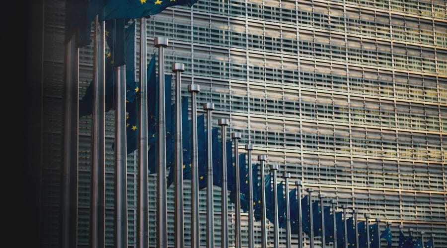 blue flag on top of building during daytime