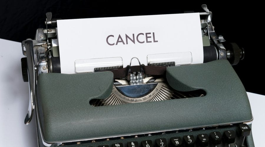 green and white typewriter on black textile