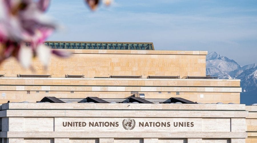 A building with a lot of flowers in front of it